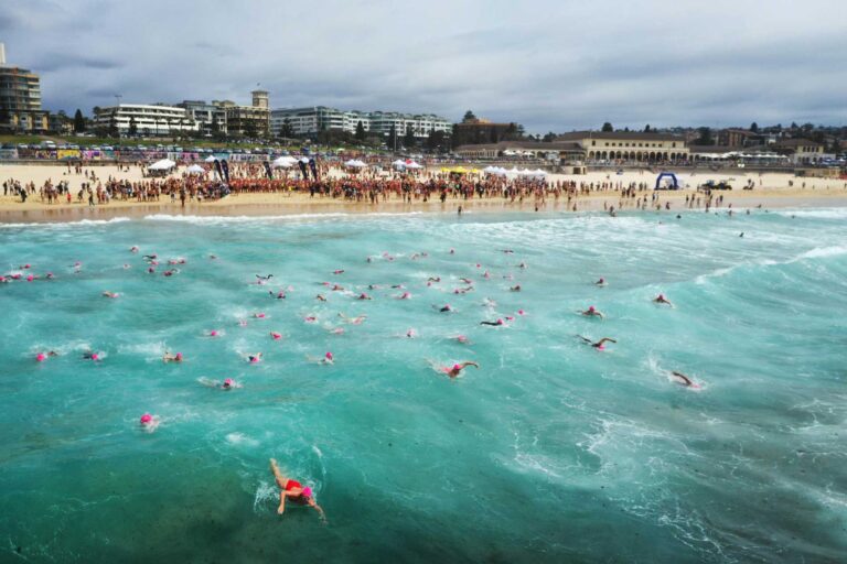 Bondi to Bronte swimmers leaving Bondi Beach